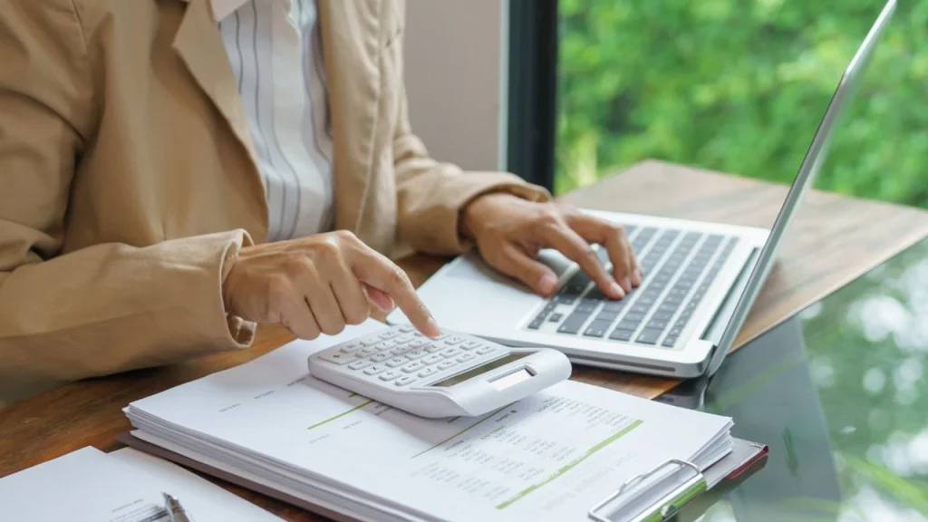 Who is watching the budget: magnifying glass over Nigerian budget documents on a desk.