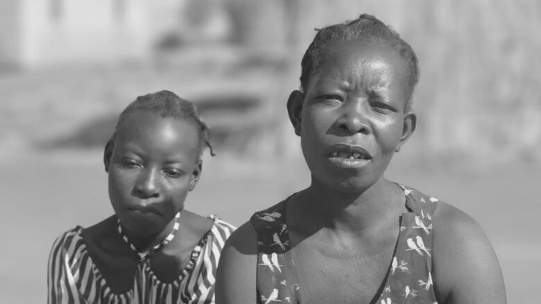 Woman and child sitting together in distress, reflecting the emotional toll of kidnap-for-ransom in Nigeria on families.
