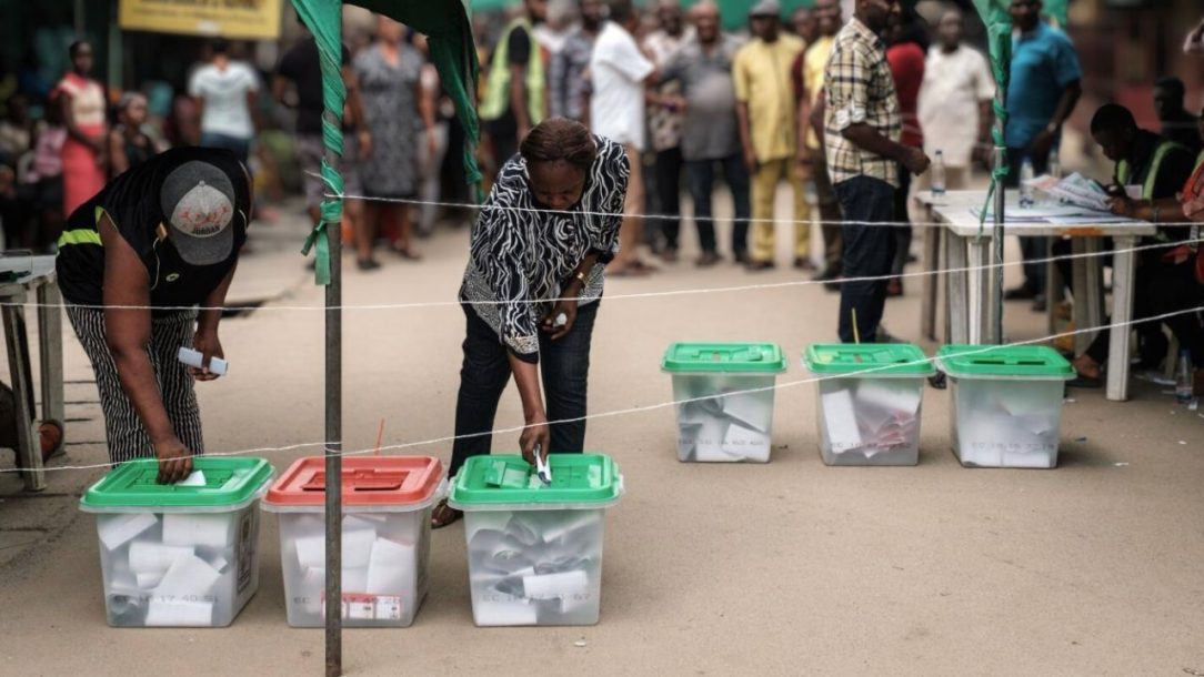 People casting their votes in Nigeria, highlighting the importance of participation despite challenges in the electoral process.